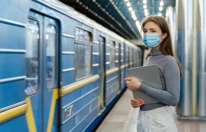 young-woman-waiting-subway-station-with-tablet (1)